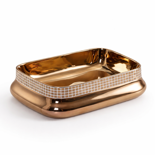 Gold-colored soap dish with mosaic pattern on a white background